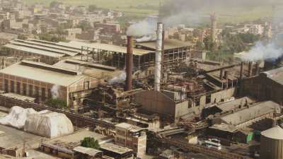 Rives du Nil et usine de canne à sucre